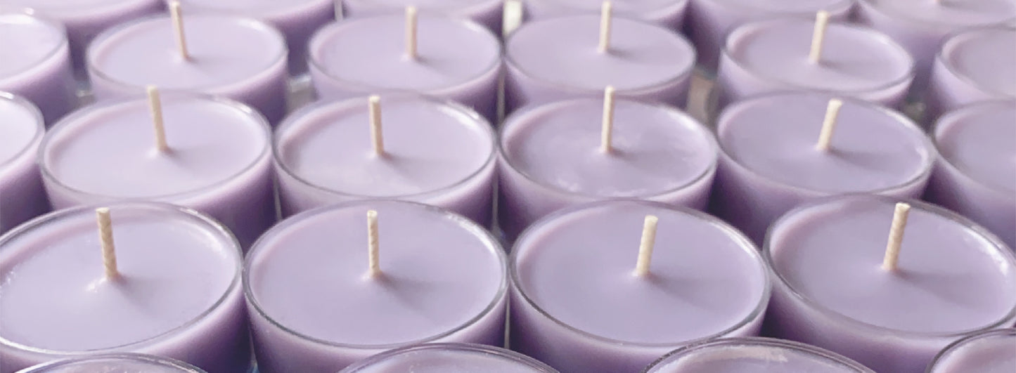 CeeCee Candle Company’s Soy Wax Tea Light Candles, displayed in clear holders with lavender hues and wicks, provide eco-friendly charm and gentle aromatherapy benefits.