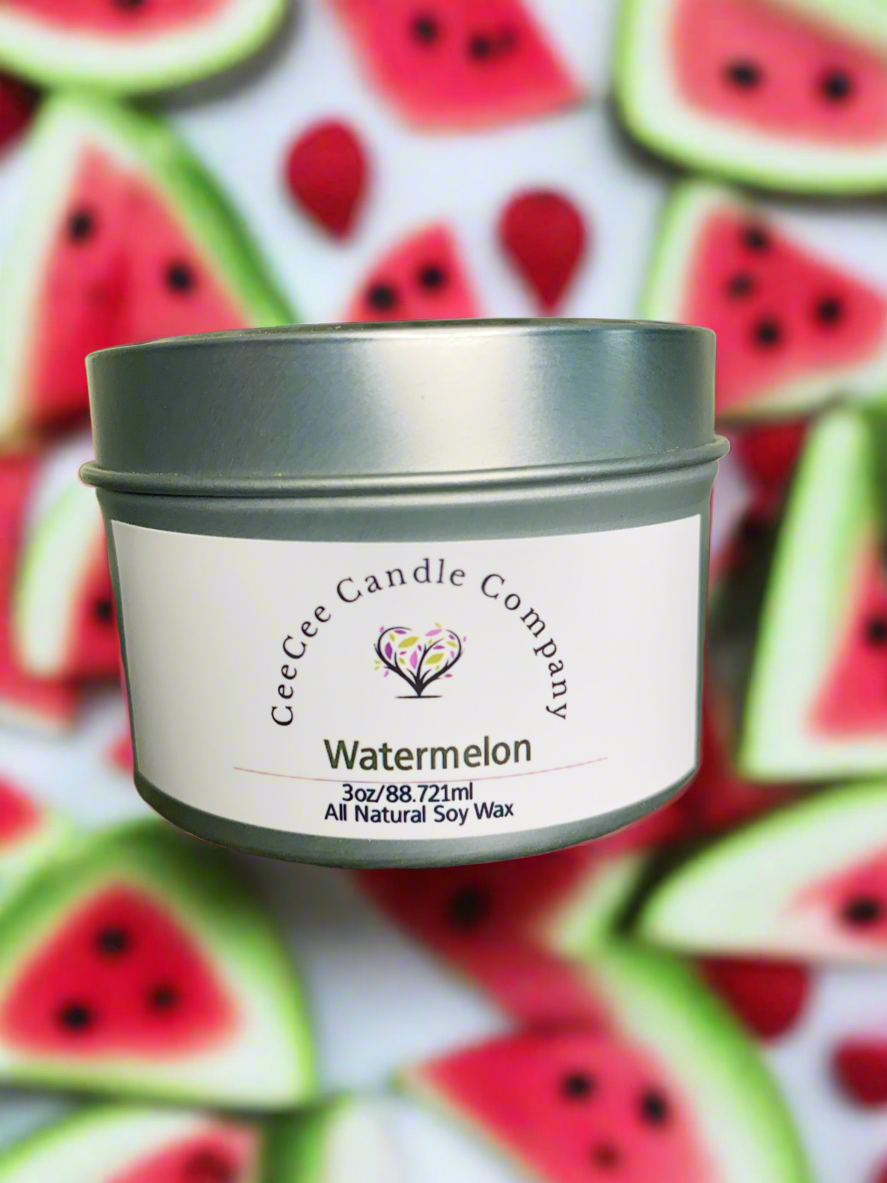 A Travel Size Soy Candle by CeeCee Candle Company is shown in front of blurred watermelon slices, emphasizing its mood-boosting scent and convenient size for travel.